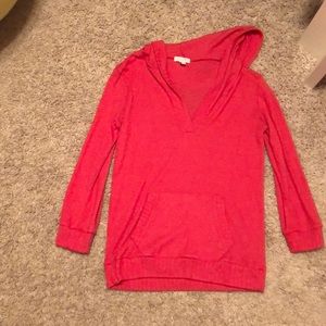 Delia’s red sweatshirt